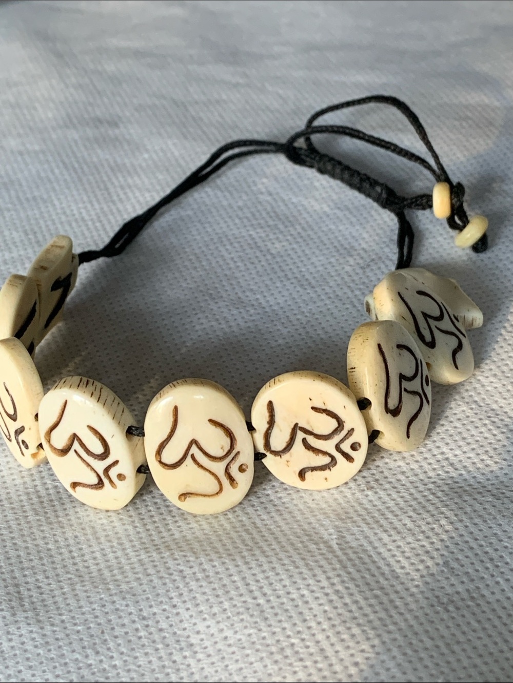 Handcrafted Ivory Bead Bracelet with Brown AUM Accents - Women Accessories
